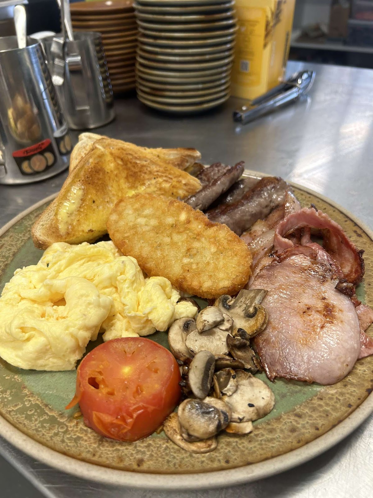 The Kittyhawk big breakfast with toast, hash brown, sausages, bacon, scrambled eggs, mushrooms and tomato